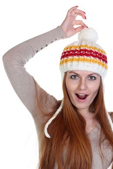 young happy woman in a knitted hat