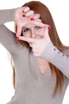 young pretty girl framing her face with her hands