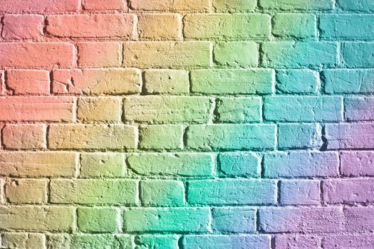 Rainbow colours on a brick wall as a background