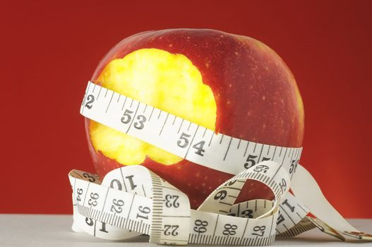 Diet Apple and Meter on a Colored Background 