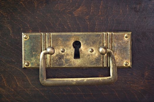 Detail of the old drawer with key hole