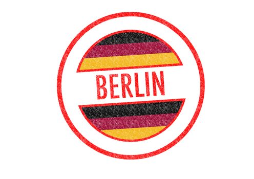 Passport-style BERLIN rubber stamp over a white background.