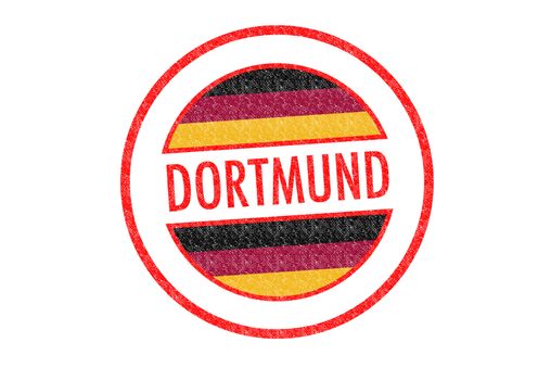 Passport-style DORTMUND rubber stamp over a white background.