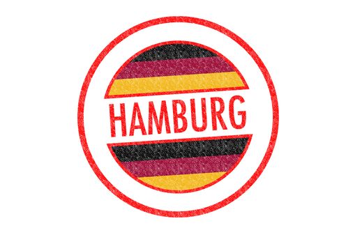 Passport-style HAMBURG rubber stamp over a white background.