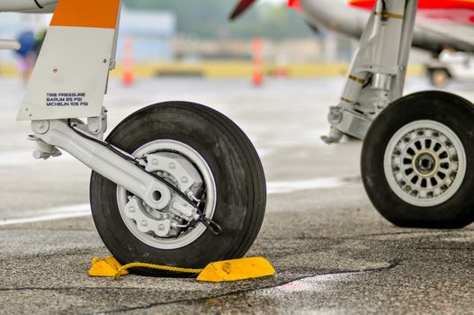 airplane parked with wheel lock