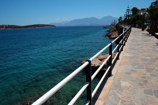 A walkway by the shore in Greece.