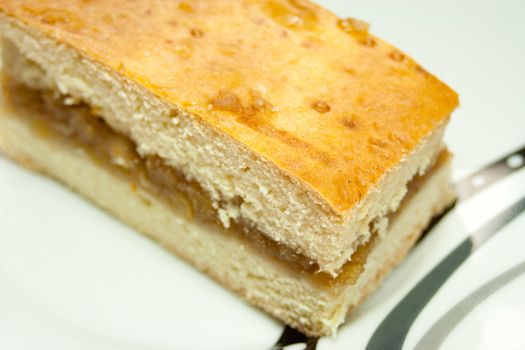 A piece of homemade apple pie on a plate