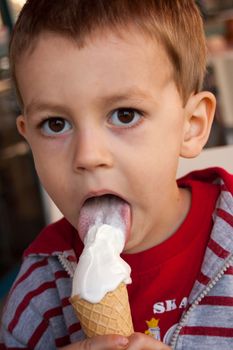 Young boy enjoying an icecream.
