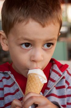Young boy enjoying an icecream.