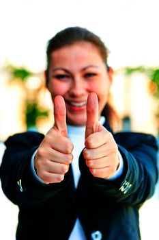 Young happy businesswoman shows that everything is fine