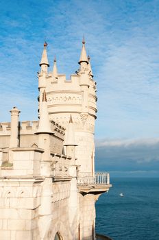Swallow's Nest Castle tower, Crimea, Ukraine, with blue sky and sea on background
