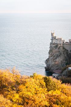 Swallow's Nest, crimea, Ukraine with autumnal trees on front