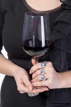 Young woman with red wine from a glass, closeup