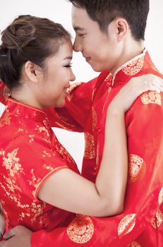 Happy Young Couple in love kissing with chinese dress