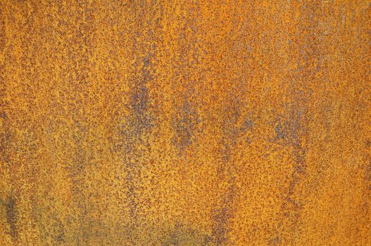 Orange Patterns on the Rusty Surface of the Metal