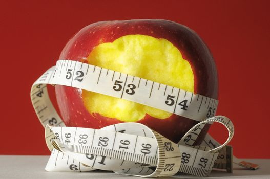 Diet Apple and Meter on a Colored Background 
