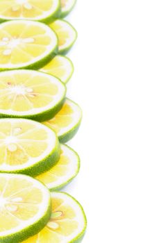 Frame of Ripe Green Lemon Slices closeup on white background