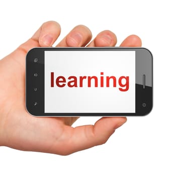 Education concept: hand holding smartphone with word Learning on display. Generic mobile smart phone in hand on White background.