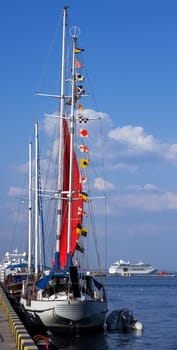 Nautical signal flags against blue sky on yacht and cruise ship sailing