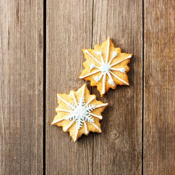 Christmas homemade gingerbread cookie over wooden table