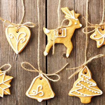 Christmas homemade gingerbread cookies over wooden table