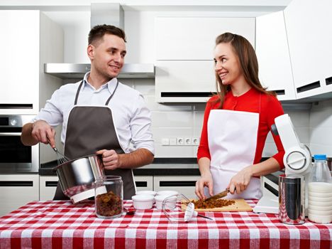 Couple at kitchen cooking together