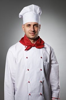 Male chef portrait against grey background