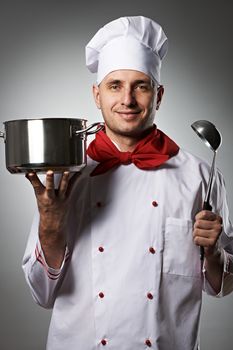 Male chef portrait against grey background