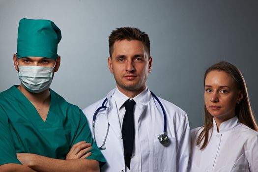 Medical team of doctors, two men and woman