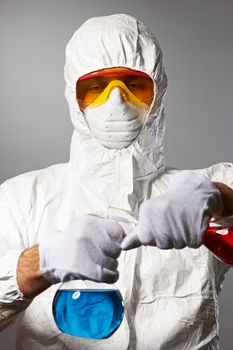 Scientist in protective wear, glasses and respirator 