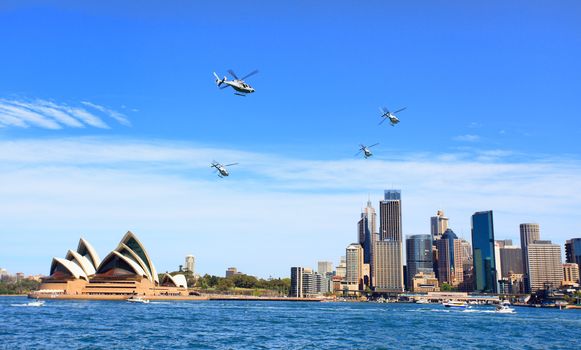 Sydney, Australia - October 6, 2013:  Four Military helicopters fly over Sydney and by the Opera House ib a beautiful spring day.