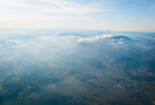 Aerial view of Alps above cloudscape and mountains