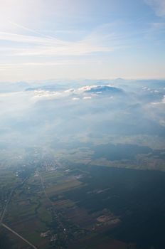 Aerial view of Alps above cloudscape and mountains