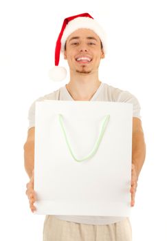 Young Santa with big white paper bag on white background. Focus on the bag.