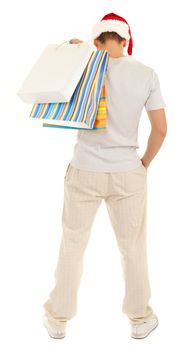 Young Santa with purchases in paper bags on white background