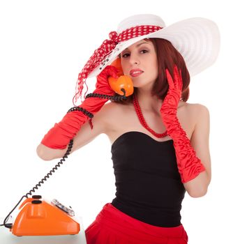 Fashion girl in retro style with vintage phone on white background