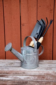 Gardening tools on wooden background