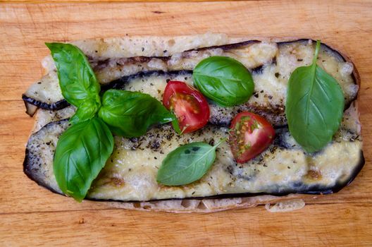 Italian pizza on a wooden board.