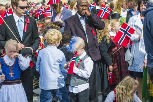Norwegian Constitution Day is the National Day of Norway and is an official national holiday observed on May 17 each year. This day is also often called the Children's Day. The picture is shot in the center of Halden City.