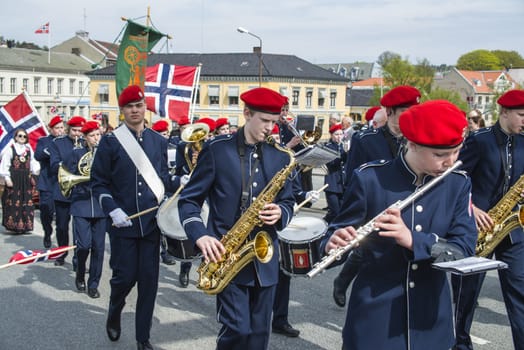 Norwegian Constitution Day is the National Day of Norway and is an official national holiday observed on May 17 each year. This day is also often called the Children's Day. The picture is shot in the center of Halden City.