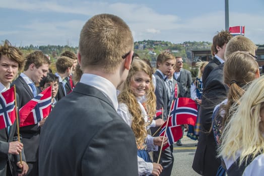 Norwegian Constitution Day is the National Day of Norway and is an official national holiday observed on May 17 each year. This day is also often called the Children's Day. The picture is shot in the center of Halden City.