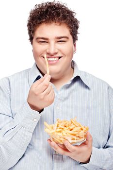 Happy young chubby man with french fries in dish, isolate on white