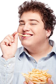 Happy young chubby man with french fries in dish, isolate on white