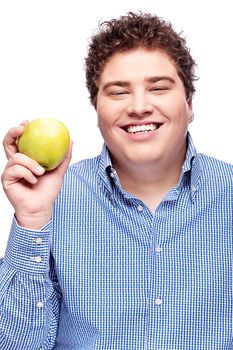 Happy chubby man holding apple, isolated on white