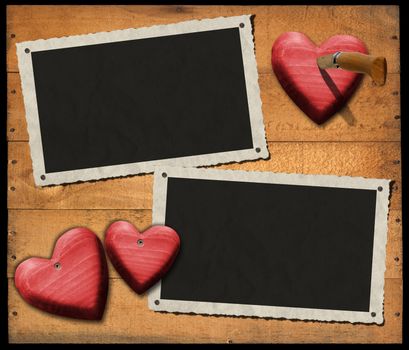 Two aged and romantic photo frames on wooden background with red hearts and folding knife
