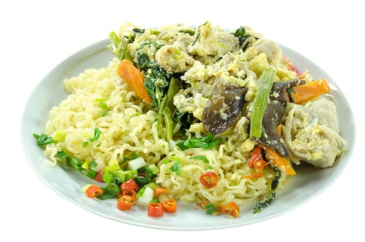 stir fried  instant noodles with pork , chili and vegetable on dish over  white background