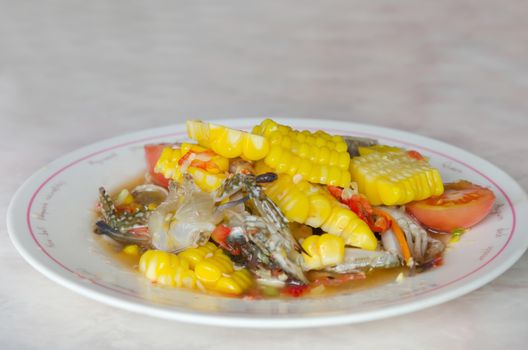spicy salad with crab and sweet corn , tomato and chili on dish
