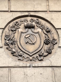 Soviet hammer and sickle emblem on the wall
