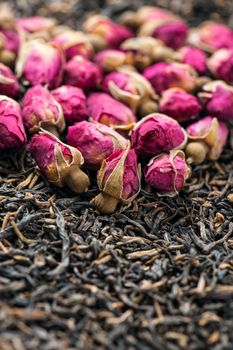 Close-up of dry roses and tea leaves