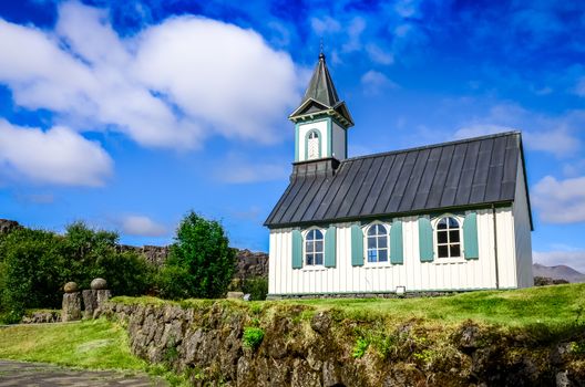 Small old church Pingvallkirkja on sunny day in Thingvellir, Iceland